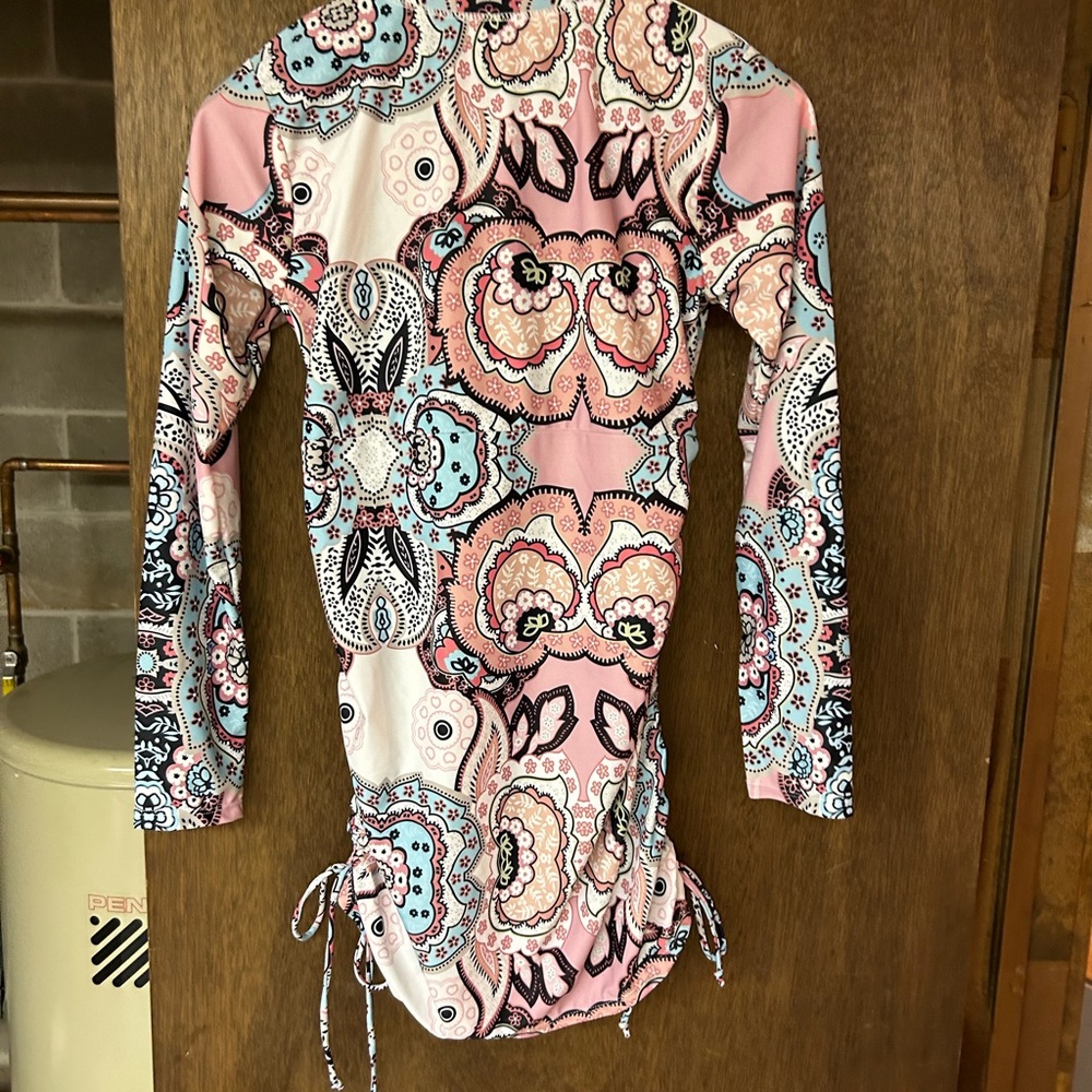 Rash guard has never been worn brand. New tags have just been removed. - Picture 2 of 4